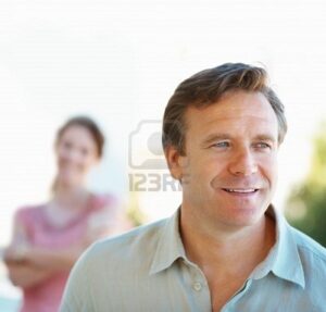 mature-man-with-a-woman-in-background
