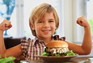 getty_rf_photo_of_strong_boy_eating_tuna_sandwich