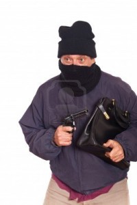 8476402-thie-aiming-a-gun-on-a-robbery