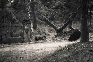 child playing swing