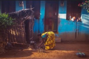 lady near a hut